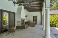 Another view of loggia for lounging by outdoor fireplace.