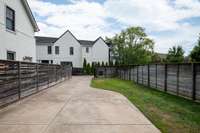 Fenced backyard perfect for a playset or garden beds!