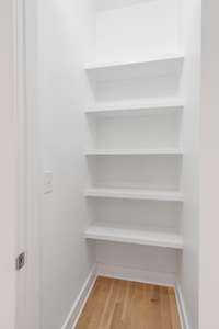 Kitchen pantry for food storage and additional overflow space.