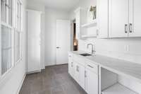 Downstairs Laundry room equipped w/sink.