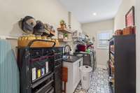 Huge laundry room with tiled floors located on main level