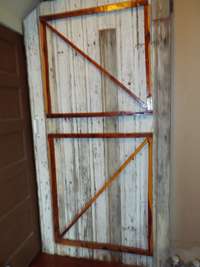 Sliding barn doors to both downstairs bath and primary bedroom