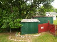Small storage building on right of property