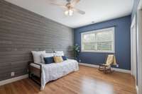 Bedroom 2 with beautiful accent wall.