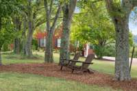 Shaded sitting area in front yard.