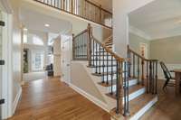 Gorgeous Entry into this home! Chandelier in Foyer has mechanical system in place to lower for ease of dusting/cleaning!  WOW.....