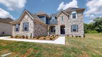 Gorgeous home that's never been lived in... Beautiful details with a front porch and stone accents invite you to stay