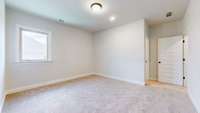 This Bedroom has a private bath with tile tub surround and tile floor