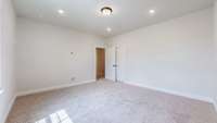 Bedroom #5 is filled with natural light and has a walk-in closet