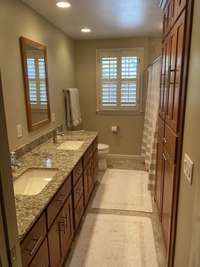 Hall bath, with double sinks and a bathtub, serves 2 bedrooms