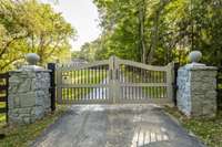 Prepare to fall in love as you follow the winding drive up to the stately designed stone entry with electric privacy gate