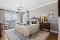 This large well-lit bedroom is part of spacious second floor primary/master suite