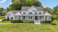 1935 Thompson Station Rd W, the first of two homes in this incredible estate.