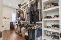 Plenty of space in this solid wood-shelved master closet!