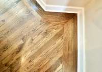 Dining Room hardwood floor inlaid on an angle.