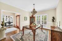 We missed the dining room.  Just off the entry foyer it features hardwood floors, floor to ceiling windows and custom moldings.