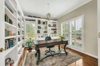 Everyone needs an office!  This wonderful library space features lots of light from floor to ceiling windows, hardwood floors, custom lighting and built-in bookcases.