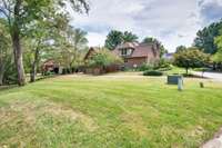 The lot is extra wide with a large area to the left of the driveway that is big enough to play soccer!