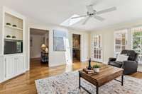 The sunroom connects to the den as well as the kitchen, and has access to the back porch.