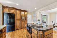 The kitchen is open to the dining room and just off the den.