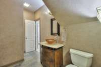 The full bath adjoining Bedroom #4 and the entry is perfect for guests.