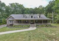 ..leading to your beautiful all-brick home, complete with a true rocking chair front porch.