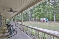 Ceiling fans keep you cool as you relax and watch the kiddos or grandbabies play outside (playsets are a negotiable item).