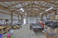 You might need more toys! Check out the ample space inside this barn! This view from the back of the barn. This barn features a 10' x 12' wide overhead door and pedestrian door as well