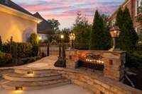 Cozy up to the gas fire pit as you enjoy evening dinners and cocktails on the private patio. Landscape lighting illuminates the area and creates a beautiful safe environment.