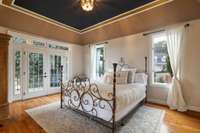 Master Suite located on the main floor with french doors leading to the expansive balcony.