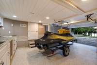 Just when you think you've seen it all, you find an additional below-deck storage epoxy-coated garage equipped with built-in kitchen appliances, perfect for storing jet-ski, kayak, fishing bait and tackle, pool equipment/lake toys, or hobby room.