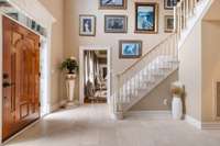 Large entry foyer with marble flooring.