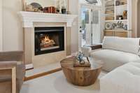 Gas fireplace with marble hearth.