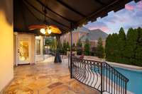 Covered patio area with retractable screen/shade for year-round entertaining.