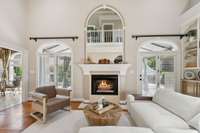 Large french doors from the living room open to the covered patio and pool area.