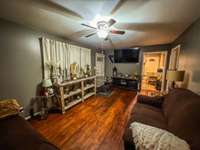 Another view of the living room showing the doorway into the eat-in kitchen.