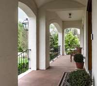 lovely archways and wide front porch for furniture, and sipping sweet tea