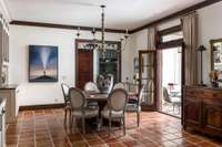 french doors access the backyard from the dining area