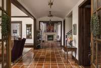 gorgeous entryway with an arched ceiling. Saltillo tile floors are rich and gorgeous