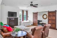 in-law suite area, built in reading nook, 2 beds, living area, kitchenette, and full bath