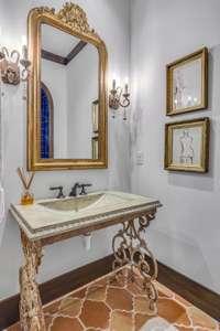 downstairs bath with beautiful Saltillo tile floor