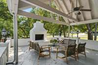 Walkout from either your kitchen or bedroom to enjoy a morning coffee on this covered patio with an outdoor wood burning fireplace