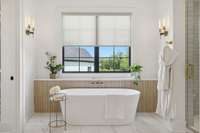 Spa days can be enjoyed with soaking tub and oversized shower with his/hers shower heads