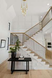 Foyer staircase with cat walk