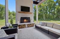 Covered Porch features wood burning fireplace and access to outdoor kitchen