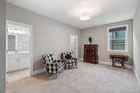 Bedroom #5 mirrors the other Bedrooms and features plush carpet, a drum light fixture and large walk-in closet.