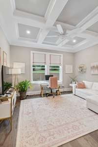 This flex room would work well as an office, work-out room, music room, main level playroom or den. Features include a coffered ceiling, ceiling fan, fabric roman shades, Glass French doors and  hardwood floors.