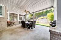 Covered patio is perfect for outdoor dining by the pool!