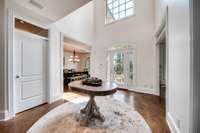 Two story foyer lights up the home!