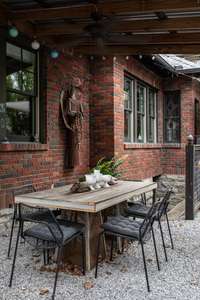 Walk down from the back porch and you'll find a covered patio, particularly suited for al-fresco dining.